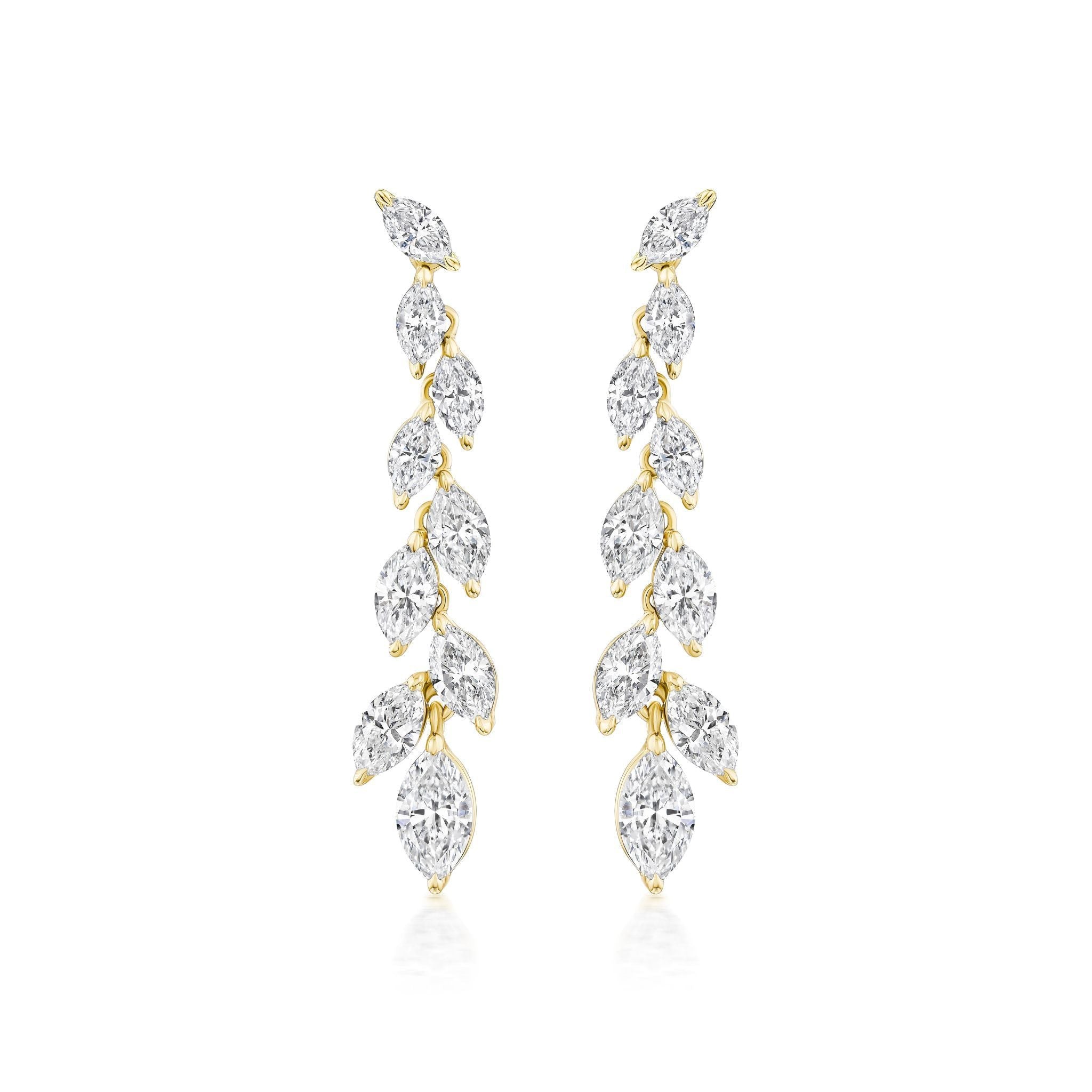 The Marquise Diamond Waterfall Drop Earrings showcase a vertical row of marquise cut diamonds in a leafy, vine-inspired gold design for a delicate, sparkling look.
