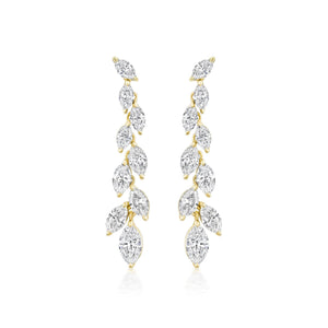 The Marquise Diamond Waterfall Drop Earrings showcase a vertical row of marquise cut diamonds in a leafy, vine-inspired gold design for a delicate, sparkling look.