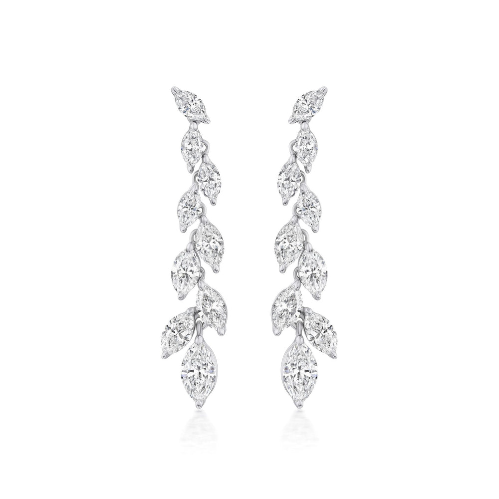 The Marquise Diamond Waterfall Drop Earrings feature a symmetrical cascading leaf design with sparkling marquise cut diamonds set in polished 18k white gold for a delicate, luxurious look.