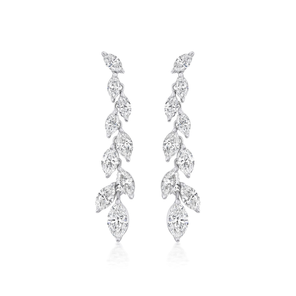 The Marquise Diamond Waterfall Drop Earrings feature a symmetrical cascading leaf design with sparkling marquise cut diamonds set in polished 18k white gold for a delicate, luxurious look.