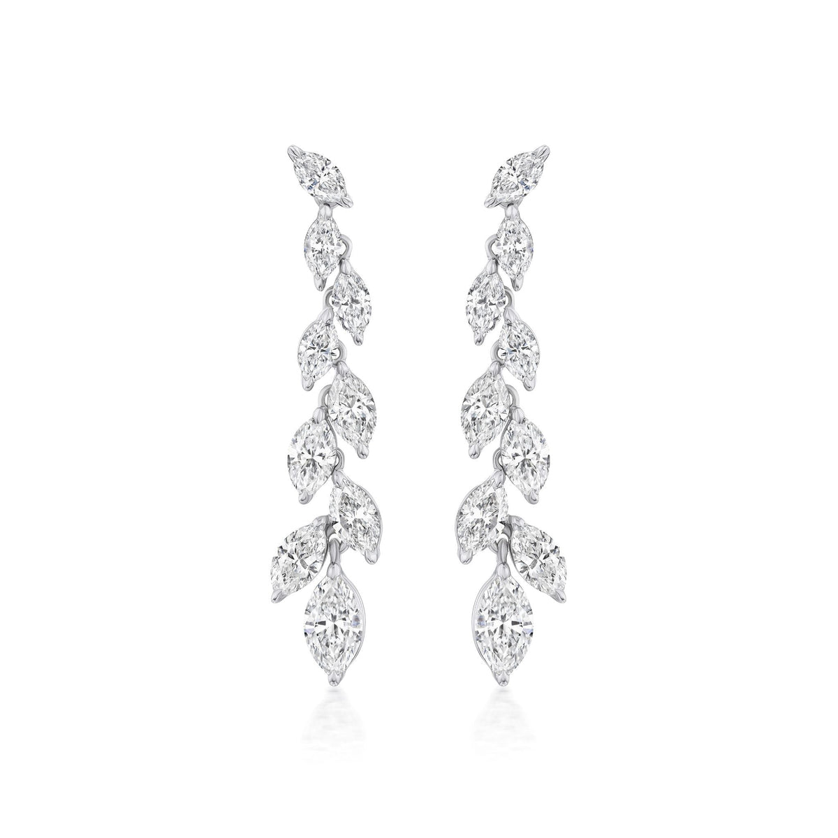 The Marquise Diamond Waterfall Drop Earrings feature a symmetrical cascading leaf design with sparkling marquise cut diamonds set in polished 18k white gold for a delicate, luxurious look.