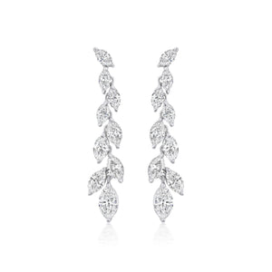 The Marquise Diamond Waterfall Drop Earrings feature a symmetrical cascading leaf design with sparkling marquise cut diamonds set in polished 18k white gold for a delicate, luxurious look.