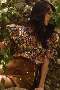 The Mayfair Blouse in Picnic Quilt paired with the Dottie Mini Skirt in Saddle. 