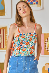 The Meg Cami in Catnap Combo has open sides that tie and stripe mixing at the straps.