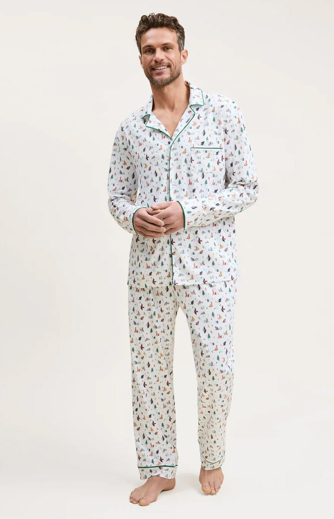 Front view of Men’s Pima pajama set in Merry Meow showing holiday cat print and green piping on a model against a light background