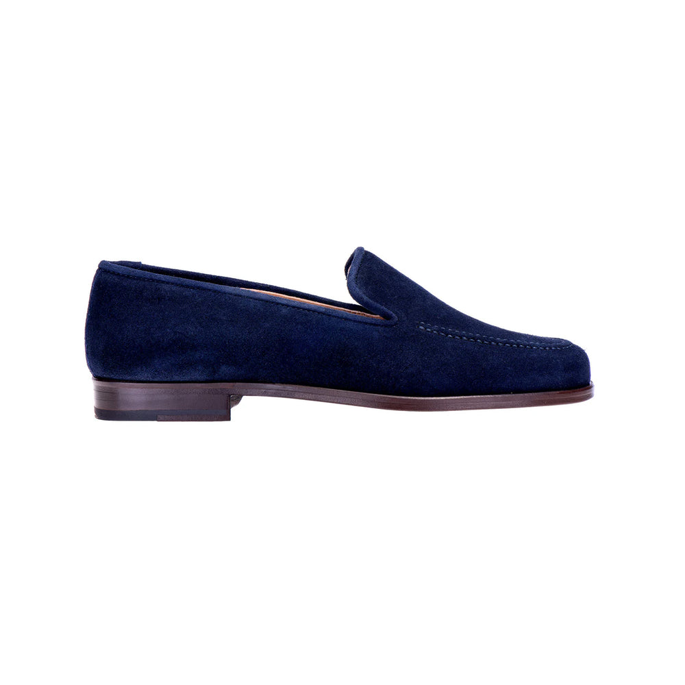 Side profile of men’s Venetian navy split suede loafer showcasing self-welt trim and leather sole on white background