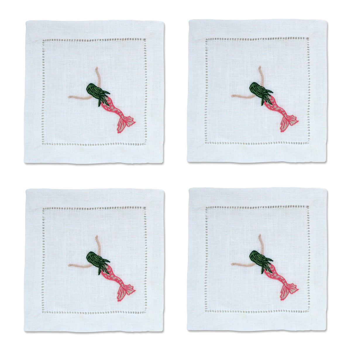Overhead view of Mermaid Cocktail Napkins, Set of 4 showcasing embroidered mermaid corner details on blue linen