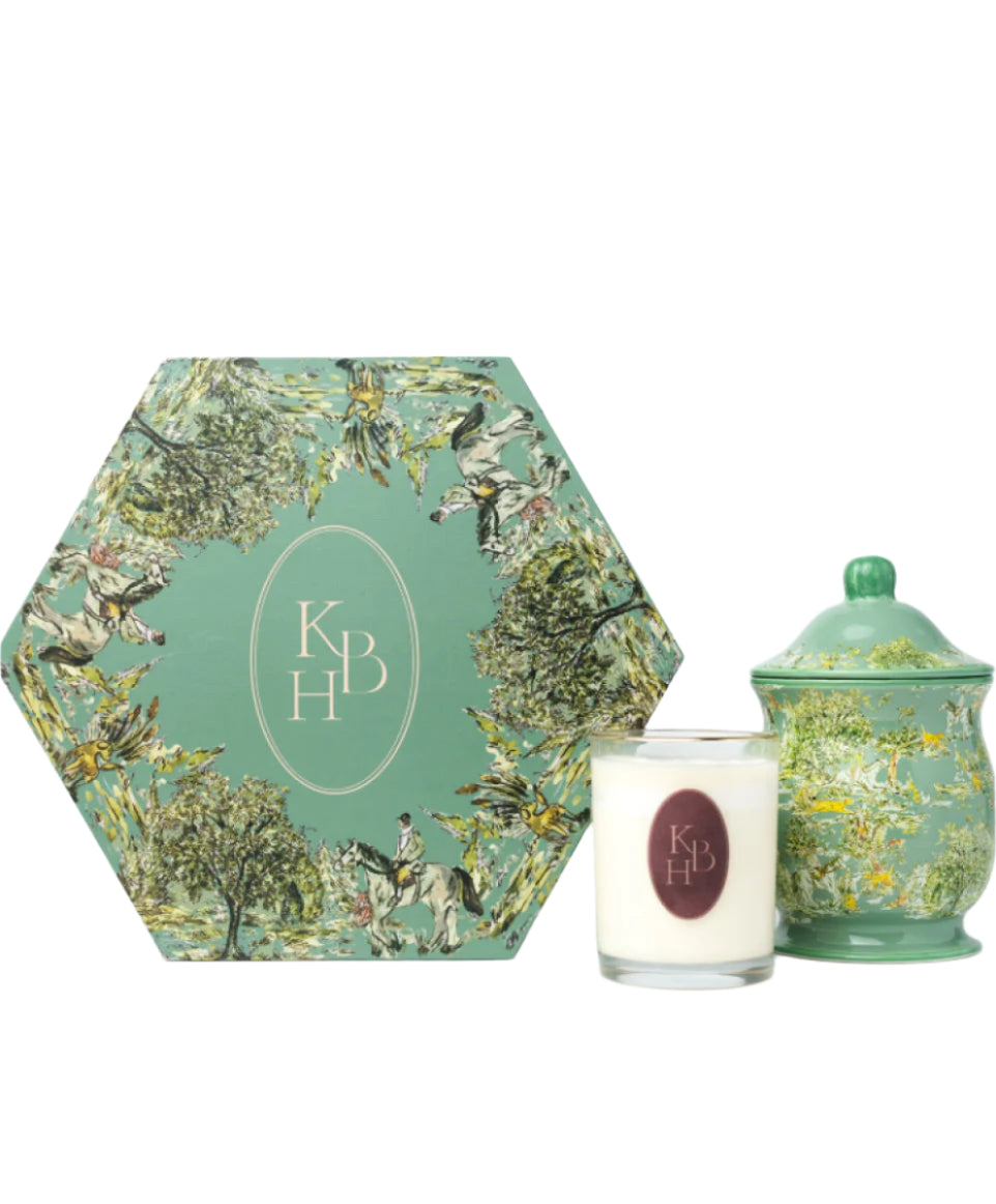 Front view of Millbrook porcelain candle and lidded vase showcasing green equestrian toile print with matching hexagonal gift box on white background