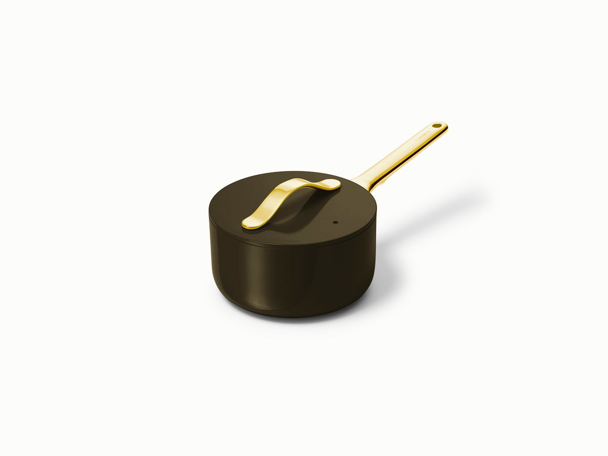 Angled side view of Mini Sauce Pan showcasing gold stainless steel handle and matching lid on white background