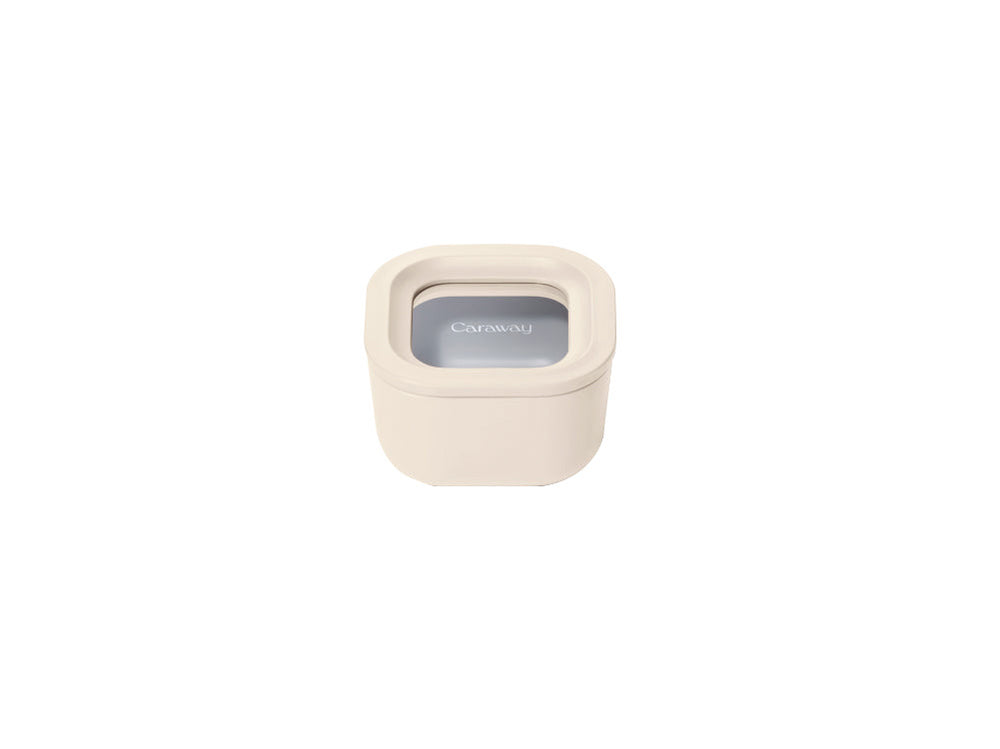 Front view of Mini Square Container in cream showcasing clear lid and compact square shape on white background