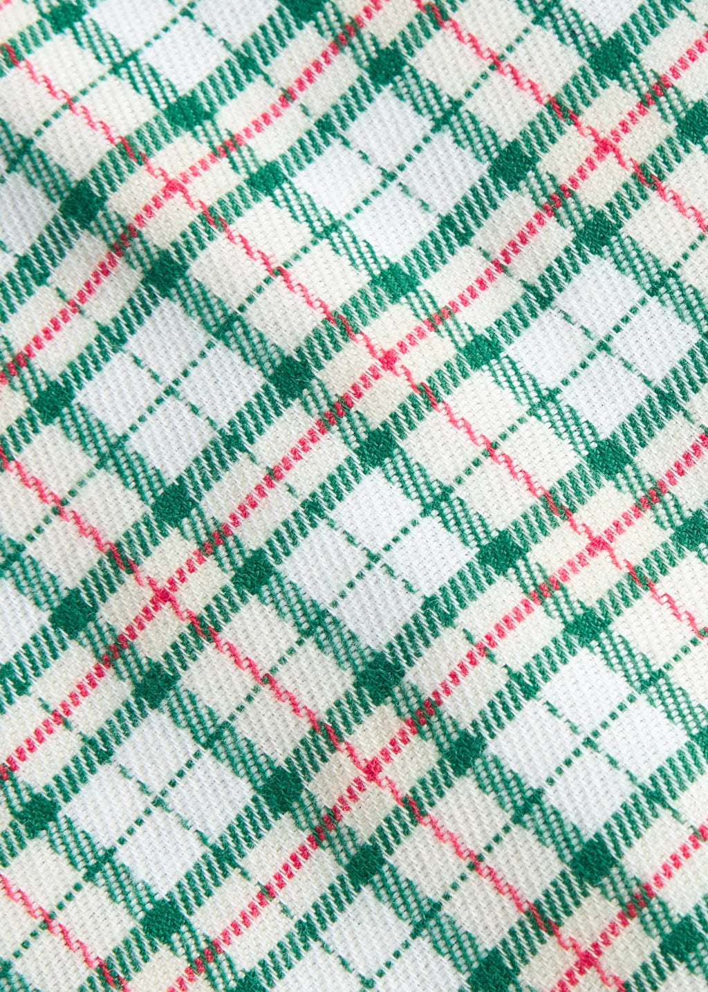 Little English traditional children's clothing. Green, red, and cream Mistletoe Tartan flannel fabric swatch