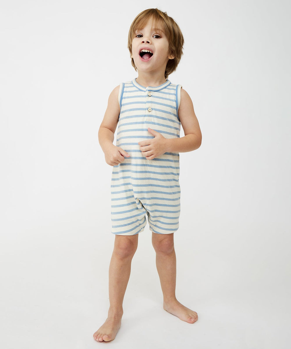 Front view of Lachlan Romper on child showing dusty blue stripes, sleeveless with front buttons and snaps on white background