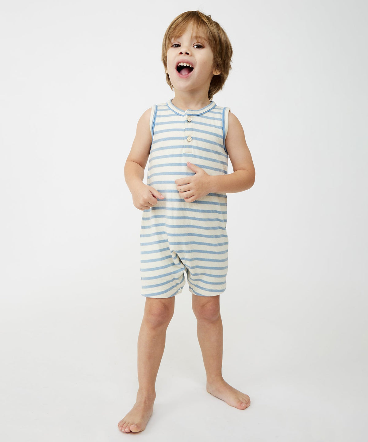 Front view of Lachlan Romper on child showing dusty blue stripes, sleeveless with front buttons and snaps on white background