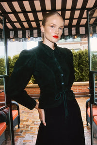 The Murphey Jacket has a button front, long sleeves with button cuffs, and a waist cinched by a belt