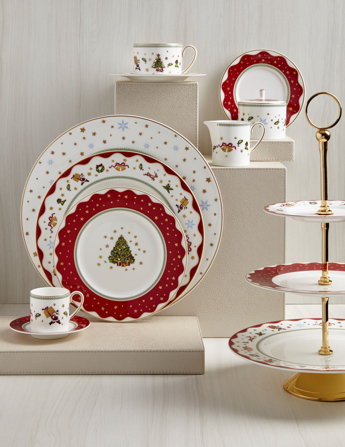 Festive My Noel tableware collection displayed on tiered stands, including an espresso cup and saucer