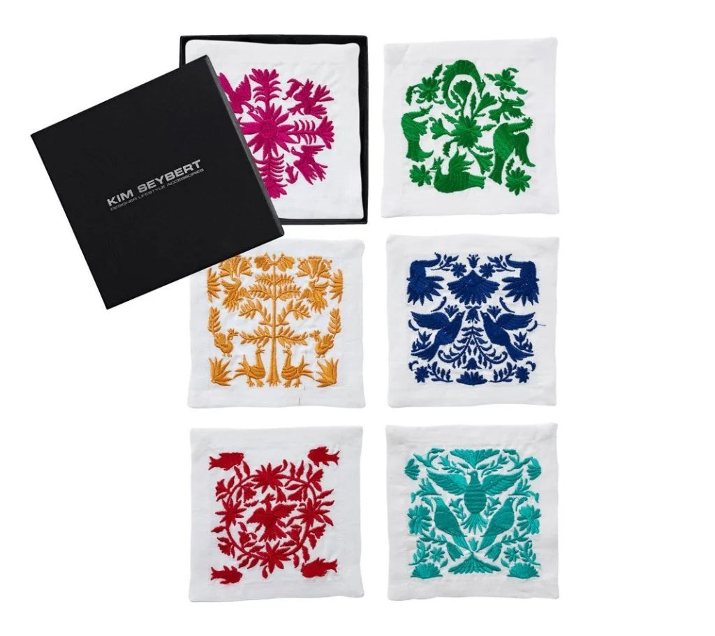 Front view of Otomi Cocktail Napkins in Multi, set of 6 in a gift box with colorful embroidered designs