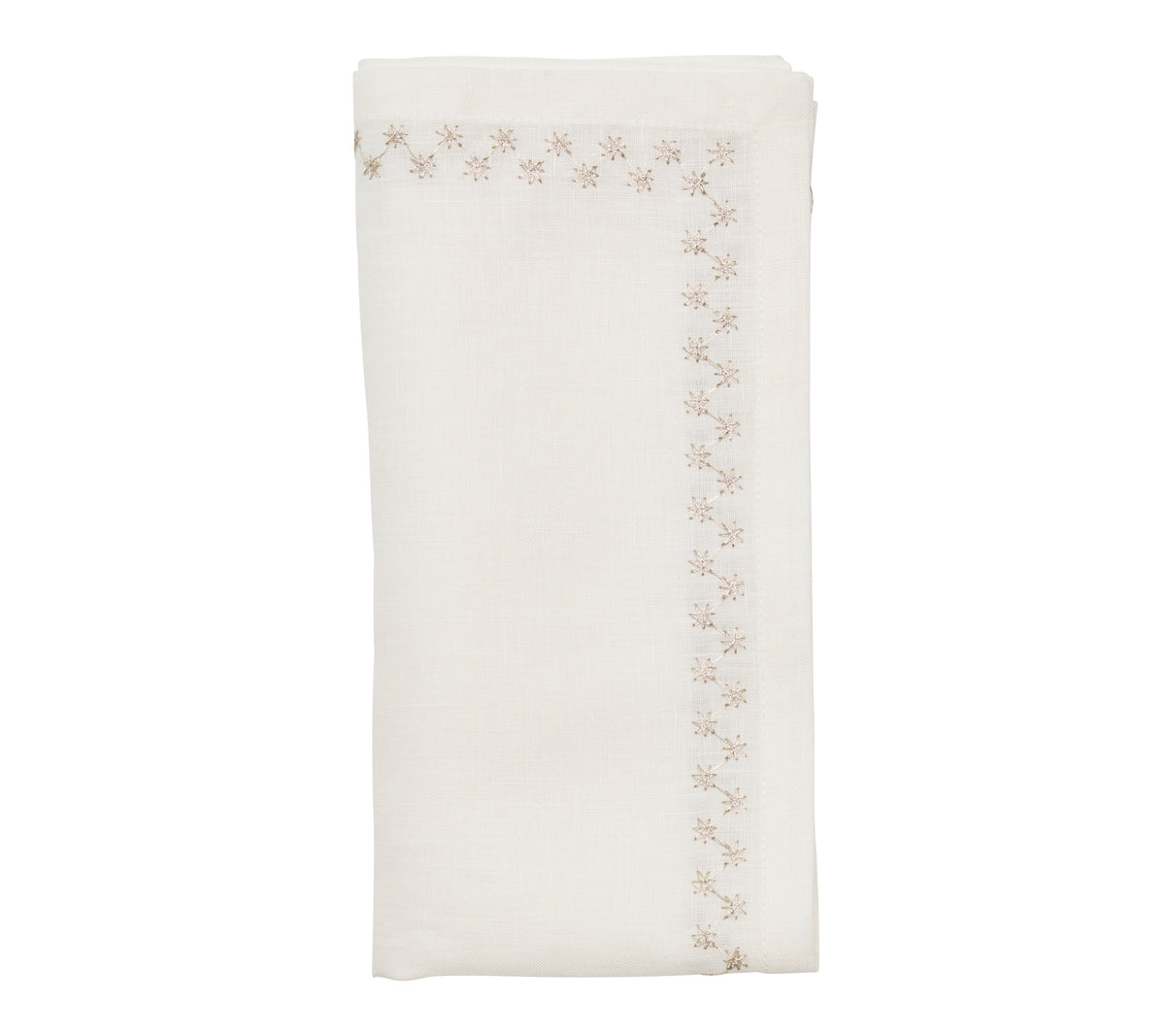 Top view of folded Starry Night napkin in white and silver showcasing metallic star-embroidered border on white background