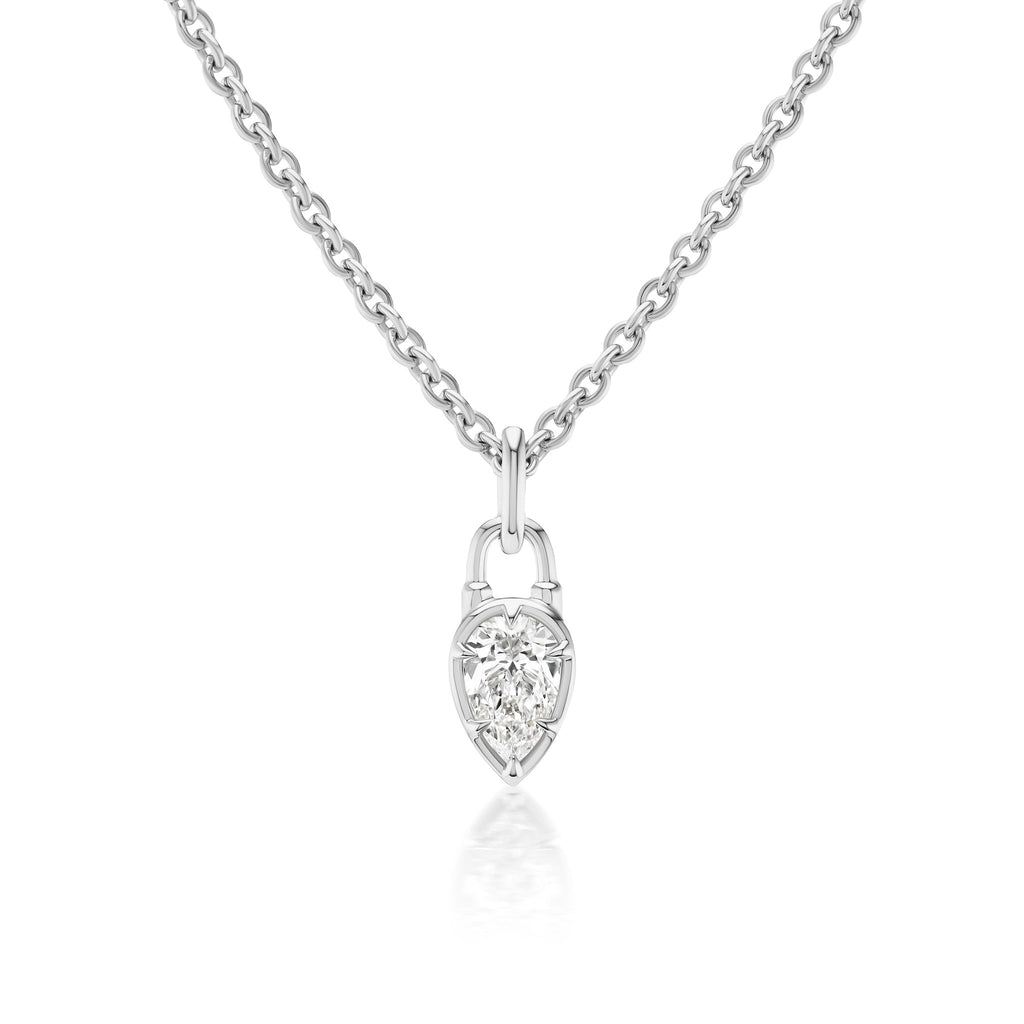 The Collet Set Locket Motif Diamond Pendant Necklace features a silver chain with a pear-shaped pendant and a sparkling center diamond, displayed against a white background.