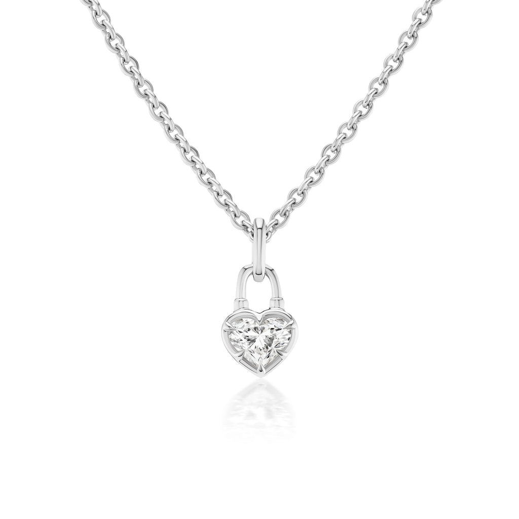 The Collet Set Locket Motif Diamond Pendant Necklace showcases a heart-shaped padlock pendant with a central sparkling diamond on a silver chain, displayed against a white background.