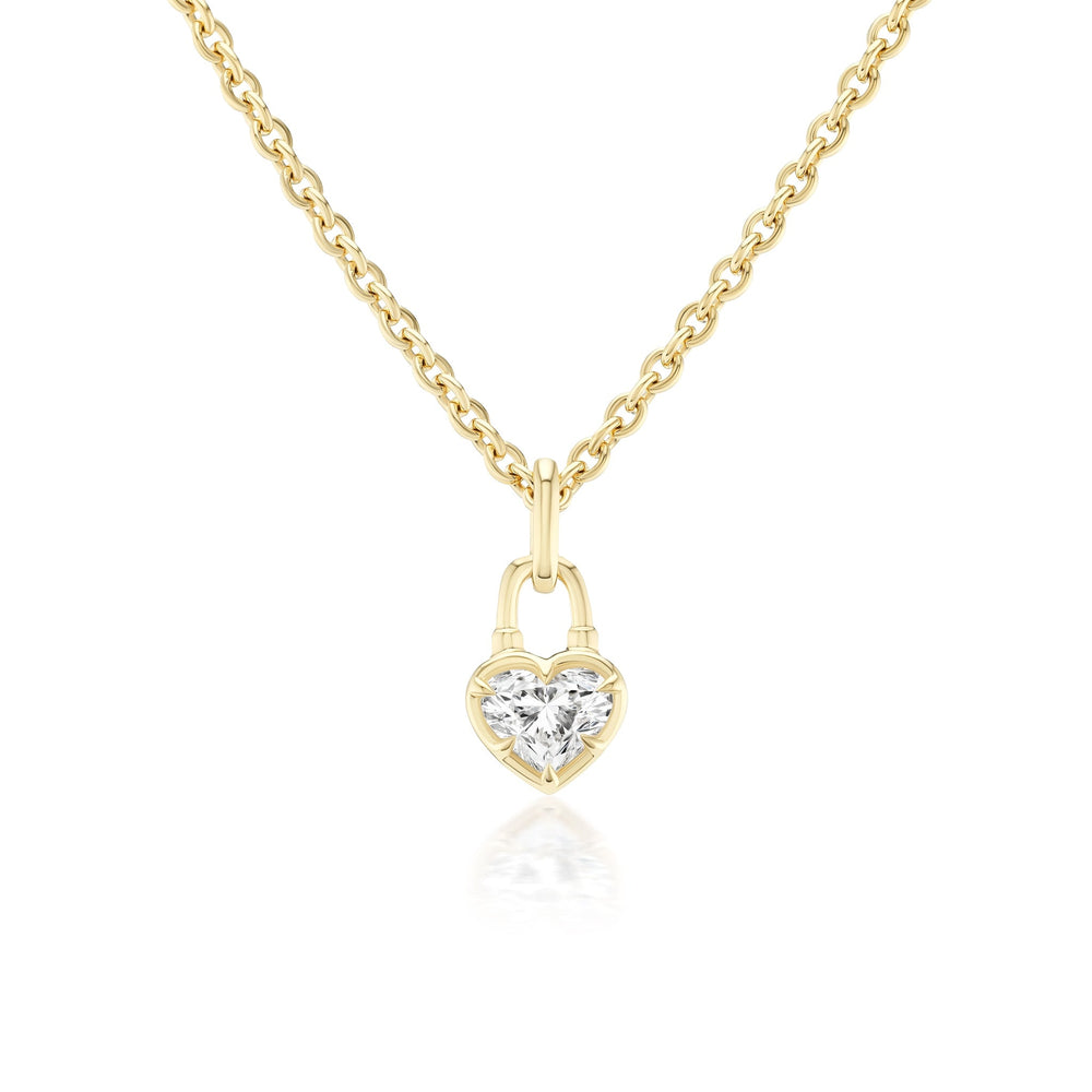 The Collet Set Locket Motif Diamond Pendant Necklace is a yellow gold chain with a heart-shaped locket and a central sparkling diamond, shown on a white background.