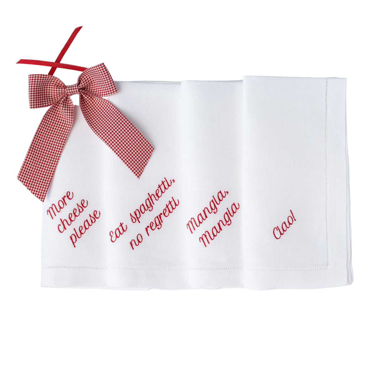Folded view of Italian dinner napkins showcasing red embroidered Italian phrases and a red gingham bow on white background