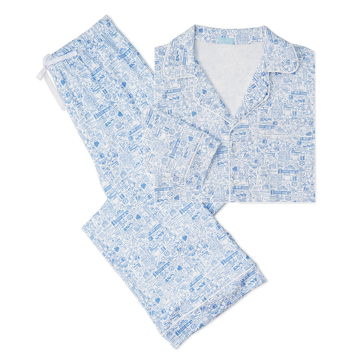 Flat lay of New York City women’s button-front long pajama set in blue showing collared top with piping and drawstring waist pants
