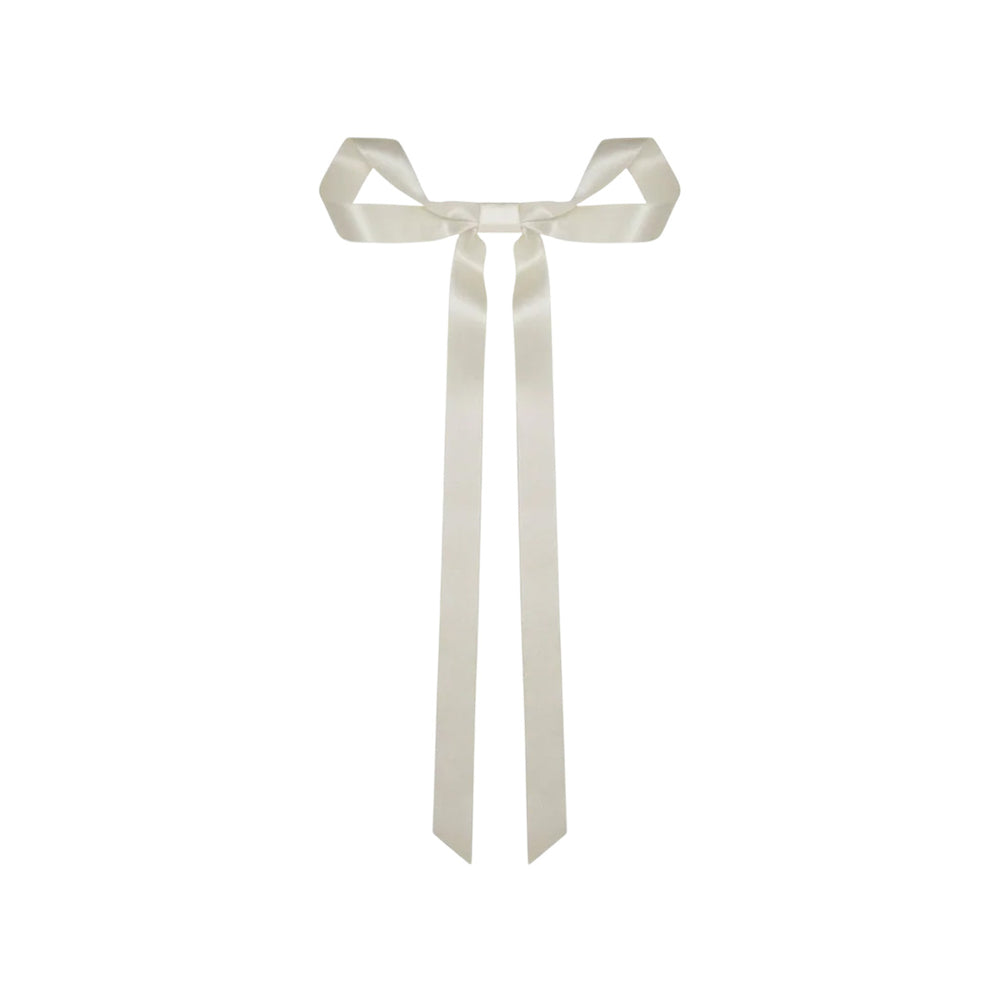 Front view of the Gretta Bow Barrette in Cream showcasing its hand-draped silk ribbon bow and long tails on a white background
