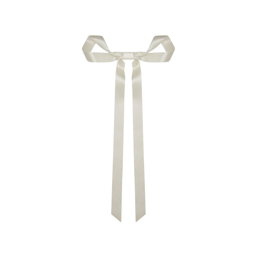 Front view of the Gretta Bow Barrette in Cream showcasing its hand-draped silk ribbon bow and long tails on a white background