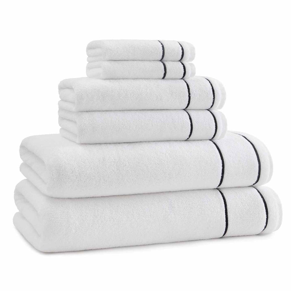 Stacked view of Newbury hand towels showing white cotton with black embroidered border on white background