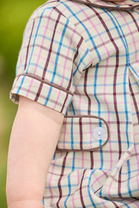 Little English traditional children's clothing.  Short sleeve peter pan bubble in brown, blue, and pink Wilmington Plaid for baby boys with button tabs and corduroy piping.