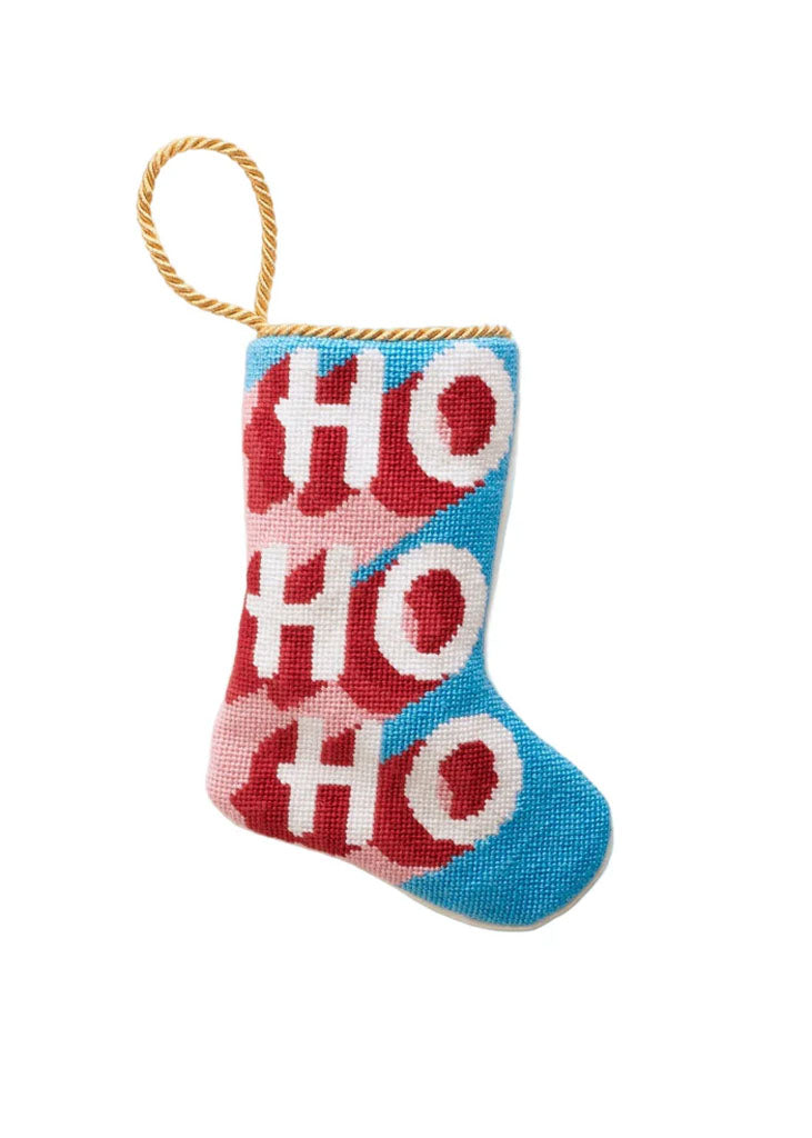 Front of BURU needlepoint stocking ornament with HO HO HO pattern in red, pink and blue and gold hanging loop