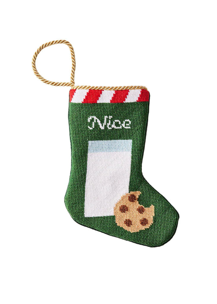 Front view of Nice bauble stocking with needlepoint Nice text, cookie motif, and gold hanging loop on white background