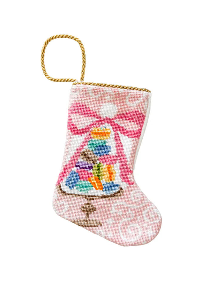 Front of Bon Appetit Macarons bauble stocking showing needlepoint macarons tower, pink swirl background, gold loop