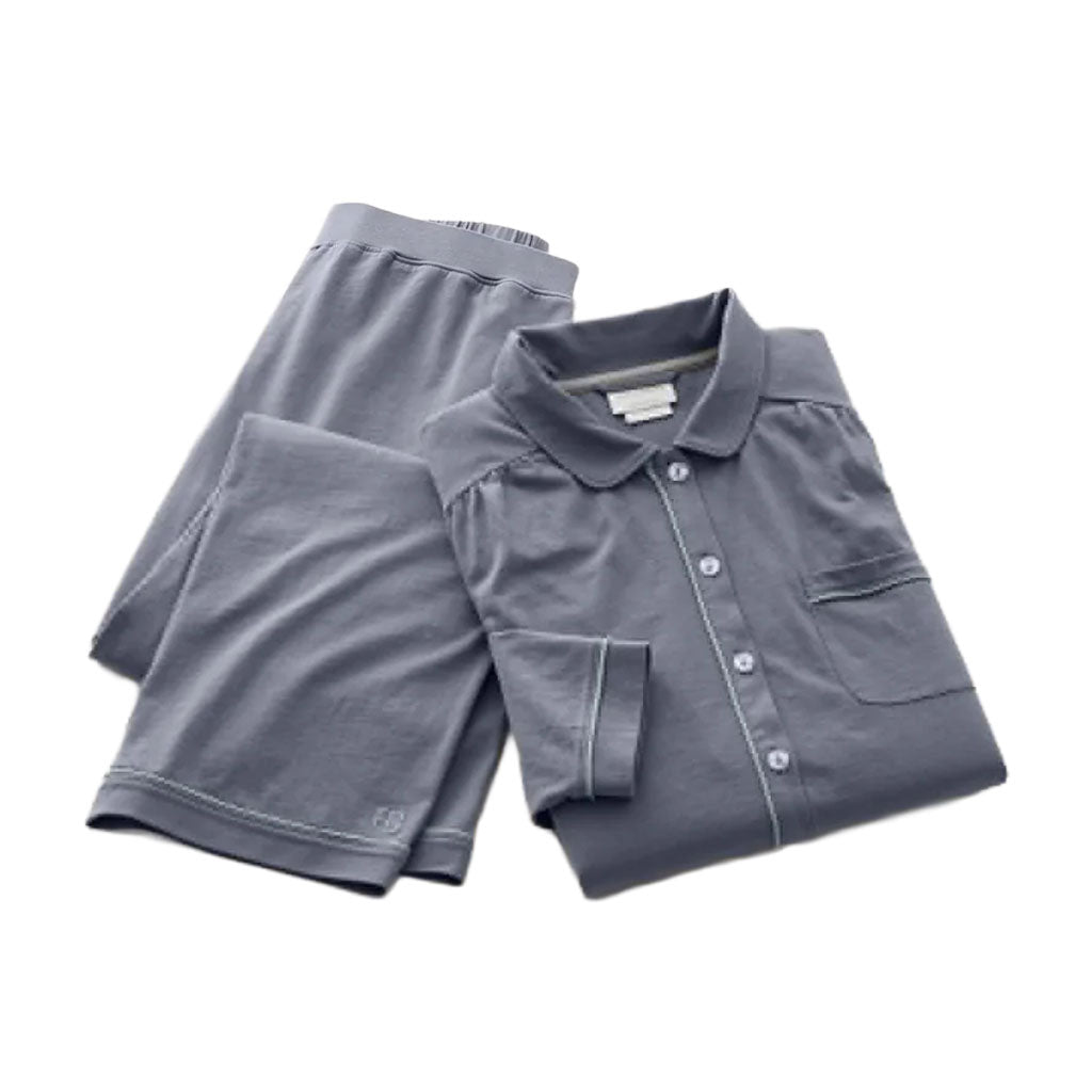 Flat lay of women’s soft knit pajama set in Mineral showing button-down shirt, pockets, and contrast piping