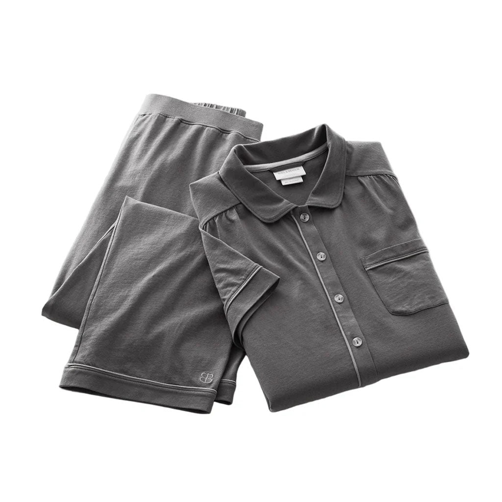 Flat lay of Women’s Soft Knit Short Sleeve and Pants Pajama Set in Night with contrast piping on white background