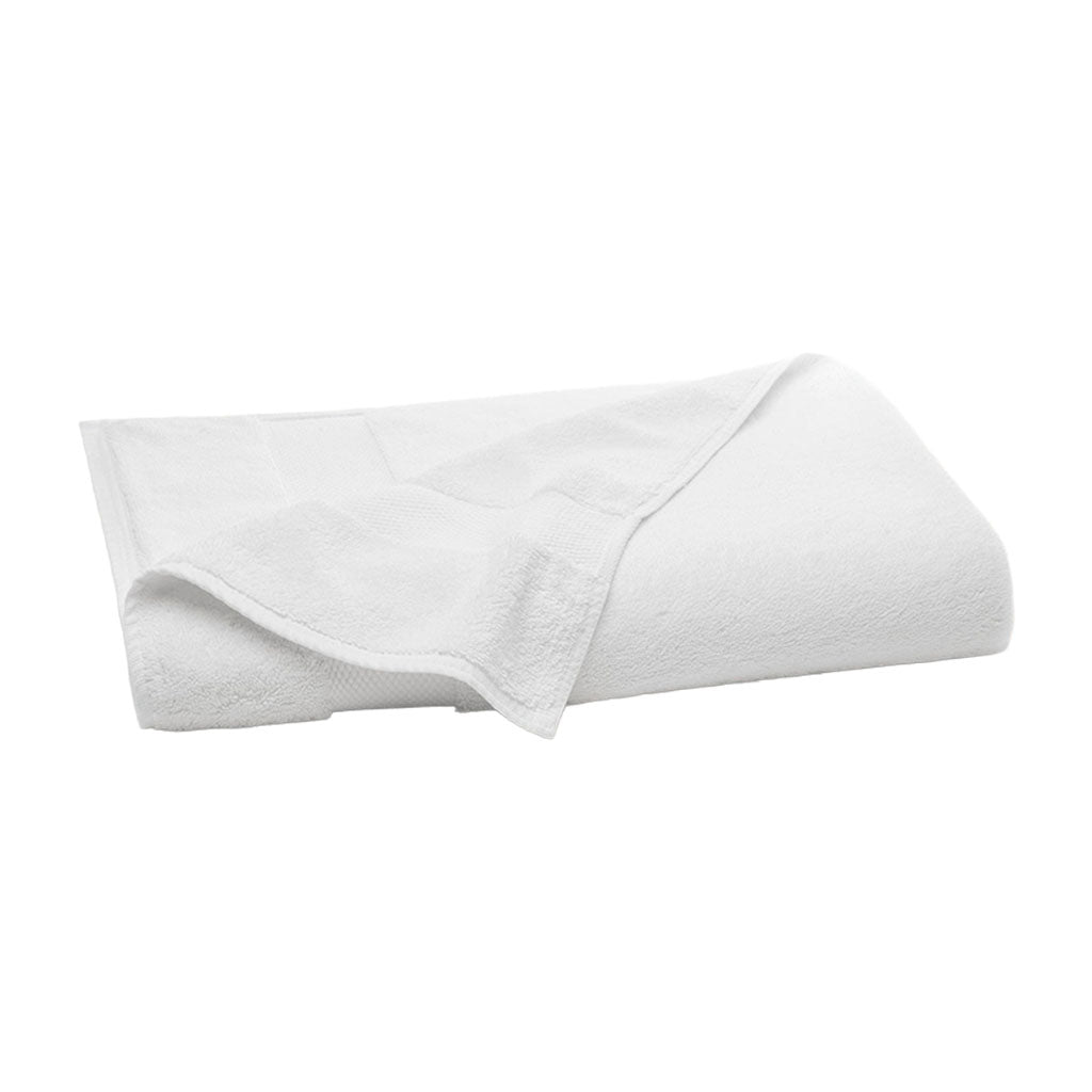 Folded view of plush bath sheet in white showing dense terry texture, hem detail, and hanging loop on white background