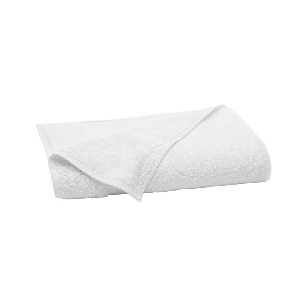 Folded view of white Plush Bath Towel showcasing plush terry texture and woven border on white background