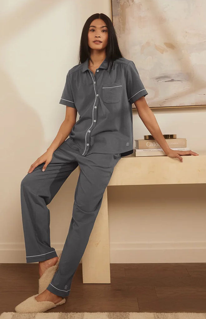 Front view of Women’s Soft Knit Short Sleeve & Pants Pajama Set in Night showcasing contrast piping against a neutral room