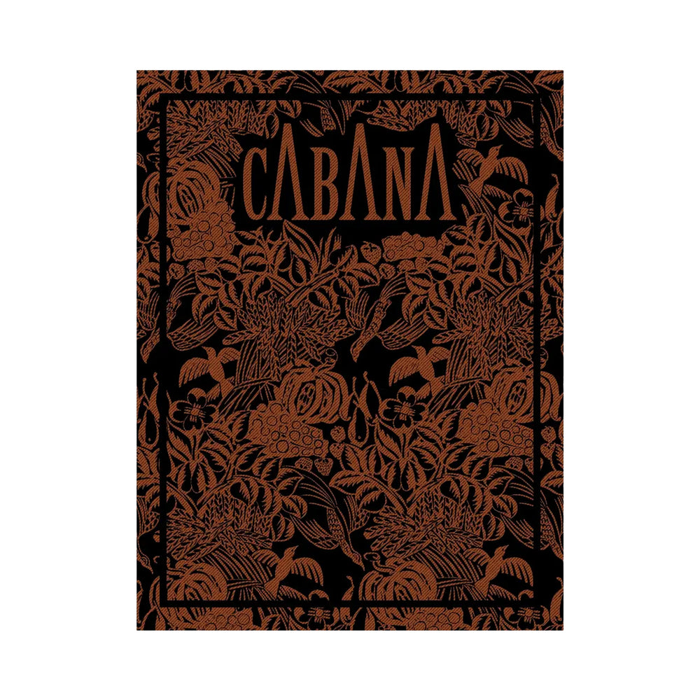 Front cover of Cabana Magazine N23 showing a black cover with copper-toned floral engraving and framed border