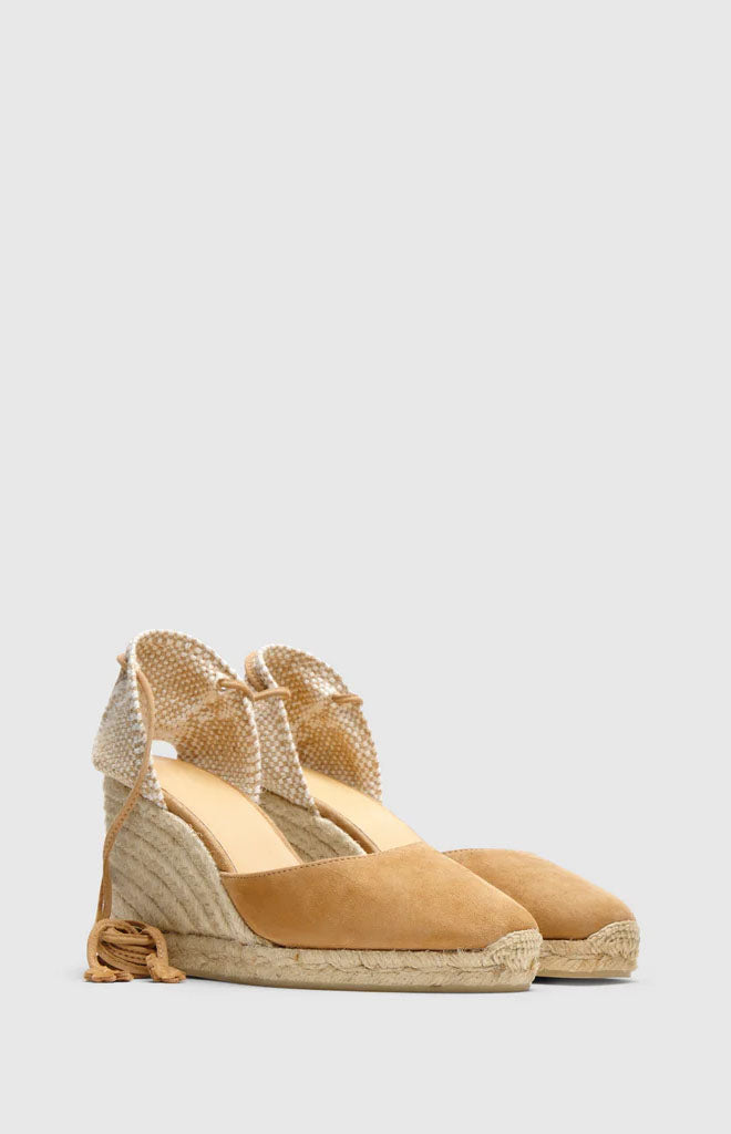Three-quarter view of Carina 8 espadrille wedge in toasted leather, showing suede upper, braided jute wedge, and ankle tie on light gray background