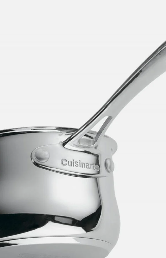 Close-up of Contour Collection 1-quart stainless steel saucepan showing riveted handle and Cuisinart logo on white background
