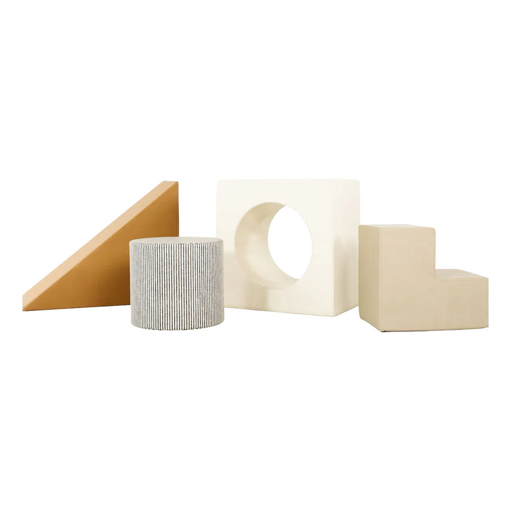 Four foam playset shapes: tan wedge, ribbed gray cylinder, white cube with hole, beige step on white background