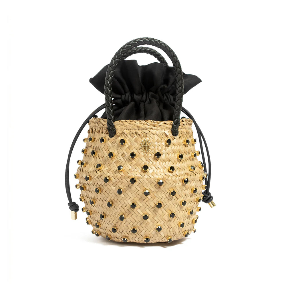 Front view of Nina Double Cotton bucket bag with woven seagrass body, black crystal studs, braided black leather handles and black drawstring lining