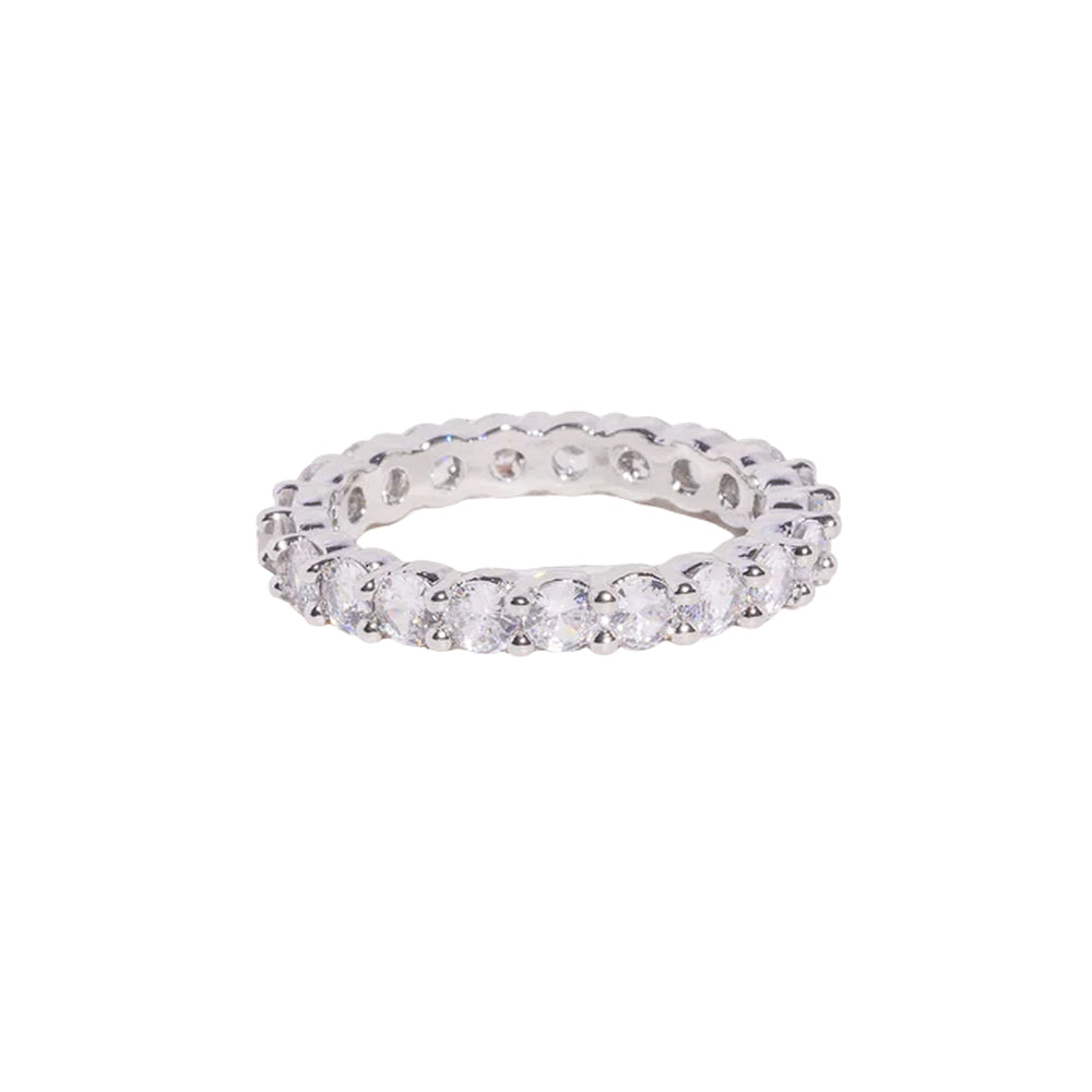 Angled view of Theo Ring in silver showcasing continuous CZ stones around a slim eternity band on white background