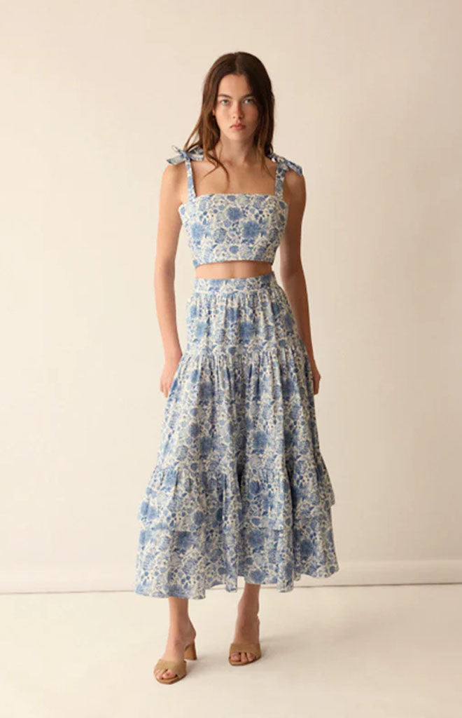 Front view of Mia Top in Blue showcasing adjustable bow straps and cropped waistline on a model against a neutral background