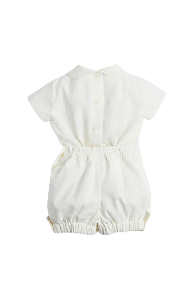 Front view of ivory Peter Pan collar short-sleeved two-piece set showcasing button-front shirt and elastic-waist shorts on white background