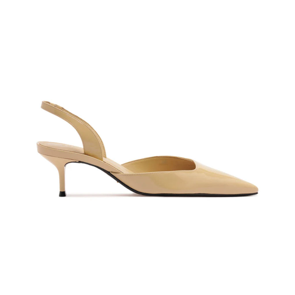Side view of Paola Mid Patent Pump in Buff Beige showcasing pointed toe, slingback, and cutout detail against a white background