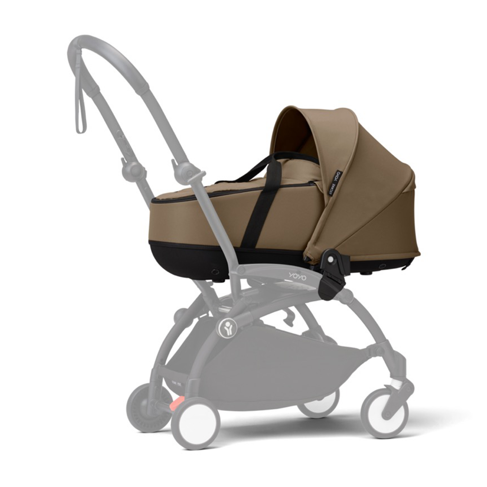 Three-quarter view of YOYO³ 0+ Newborn Pack in Toffee on YOYO³ stroller frame showcasing the bassinet with extended canopy on white background