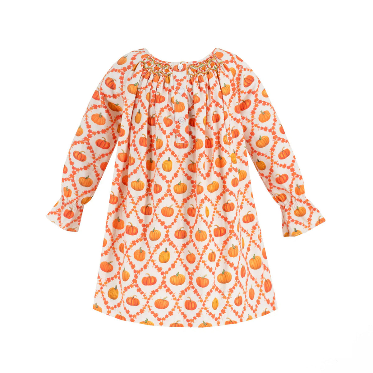Front view of Autumn Girl Dress showcasing orange pumpkin-and-leaf print, hand-smocked neckline and ruffle cuffs on white background