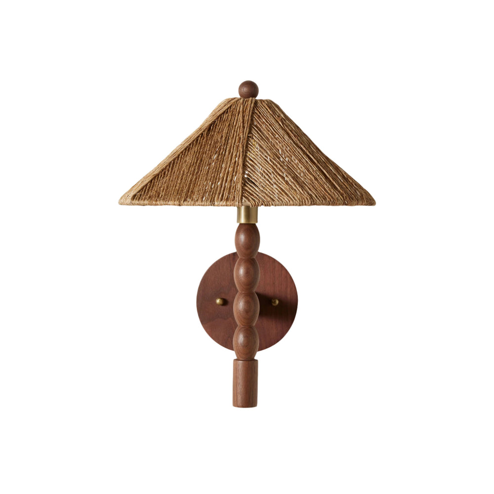 Front view of Alhambra Sconce showcasing hand-turned walnut base, antique brass accent, and woven jute shade on white background